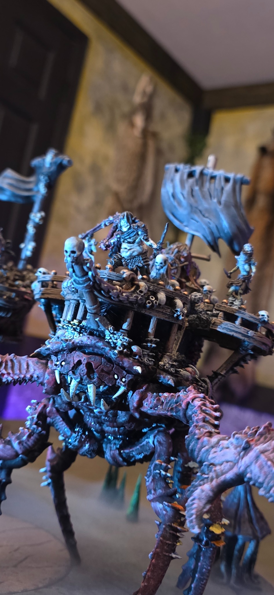 Painted fantasy miniature mounted on a monstrous war platform
